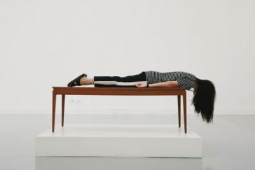 Lady laying face down on a table